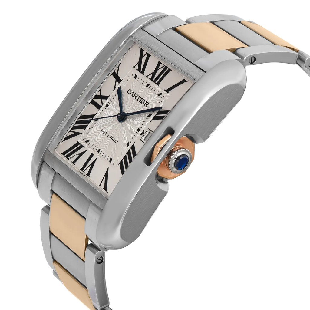 An image of a pre-owned women's Cartier wristwatch featuring a date indicator. The watch is shown from a slightly elevated angle, highlighting its rectangular face with Roman numerals and a two-tone metal bracelet. The focus is on the side of the watch, capturing the crown adorned with a blue gem, from a close-up distance.