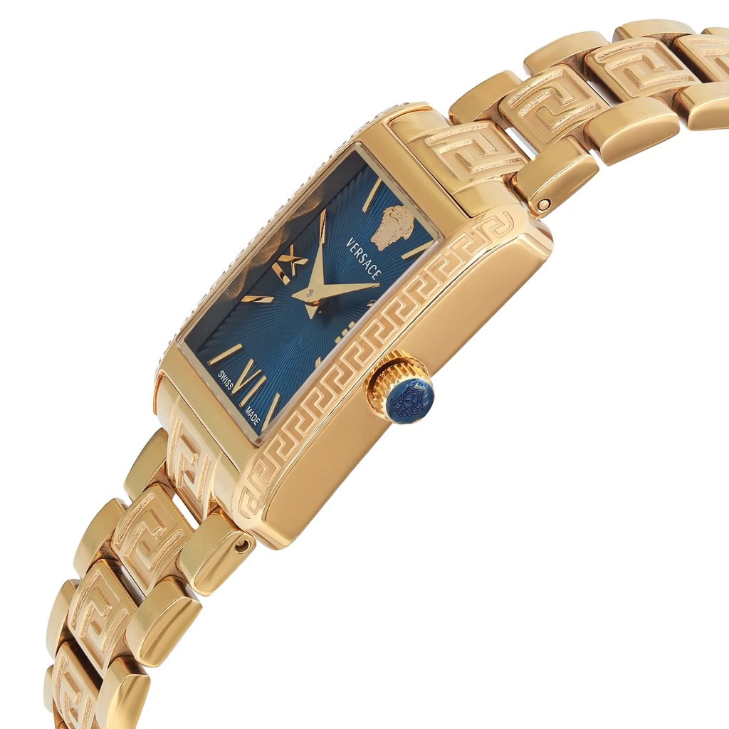 An image of a Versace women's dress wristwatch displayed at a side profile angle, showcasing the crown. The watch features a blue rectangular dial and a gold-plated, stainless steel band and case. The intricate detailing on the band and case is visible, emphasizing its formal style. The watch is in display model condition, highlighting its elegant design.
