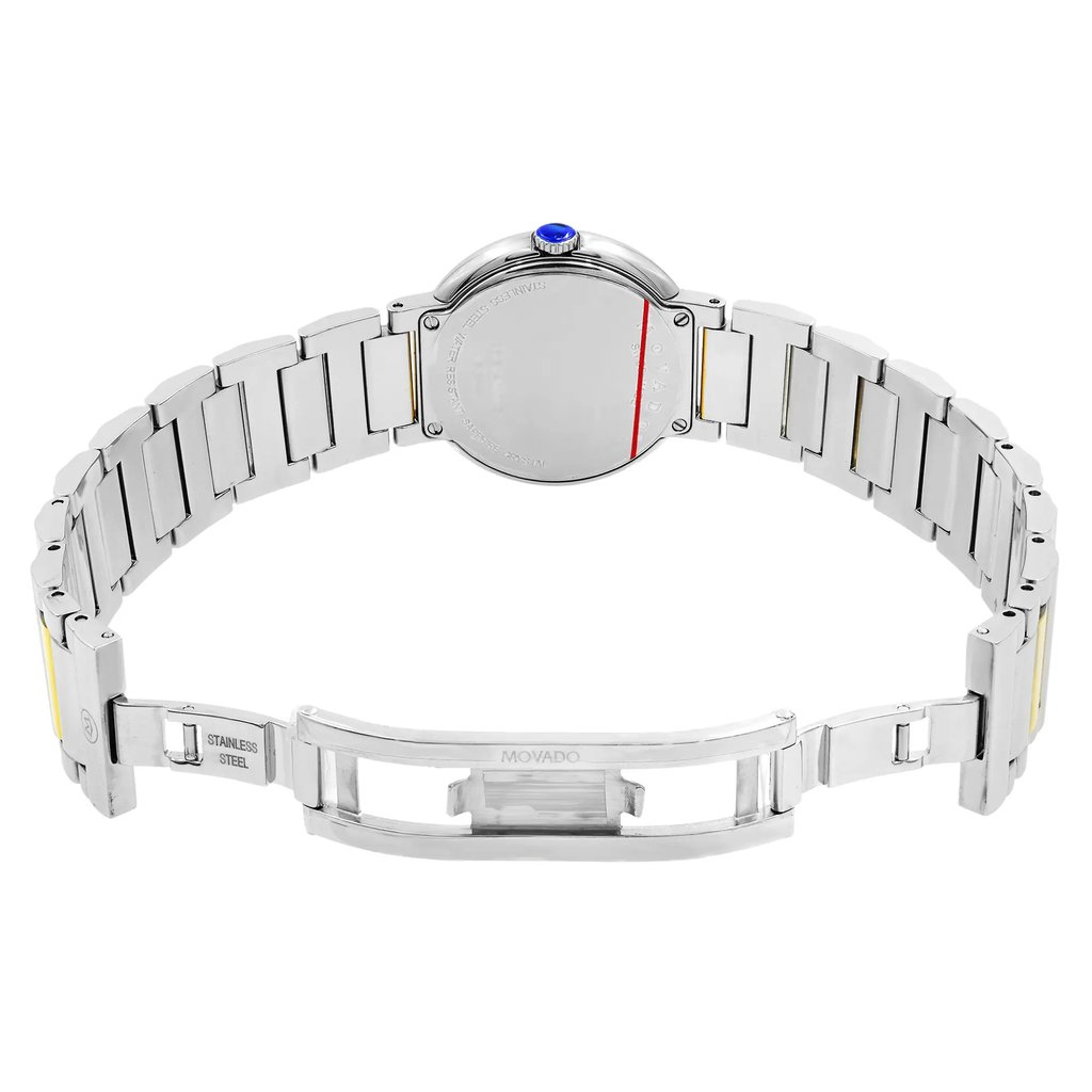 An image of a pre-owned wristwatch taken from the back view, showing the open clasp. The watch is positioned at a slight angle, highlighting the stainless steel bracelet with gold accents. The focus is on the case back, displaying the brand name engraved. The image is taken at a medium distance to capture the details of the bracelet and clasp design.