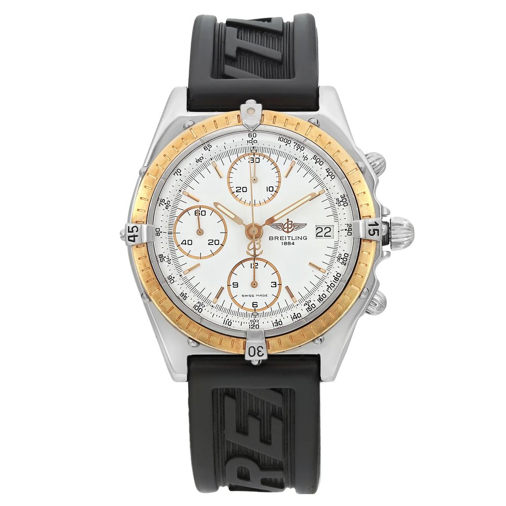 An image of a pre-owned Breitling men's wristwatch in casual style, presented in a full frontal view. The round stainless steel case supports a gold bezel with minor nicks, and a white dial featuring stick indexes and a 12-hour layout with additional sub-dials. The watch is equipped with a black rubber band that shows signs of wear. The watch is photographed from the front at a close distance, ensuring all details are visible.