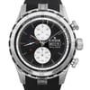 An image of an unworn Edox men's wristwatch in excellent condition, featuring a round stainless steel case with a gray bezel, and a black rubber band. The watch face is black with arrow markers and three subdials indicating chronograph functions and small seconds. It also includes a day/date display, luminous hands, and is labeled "100 m / 330 ft" indicating water resistance. The image is a front close-up shot, showing the watch head-on, with the watch positioned centrally and occupying most of the frame, providing clear visibility of the details.