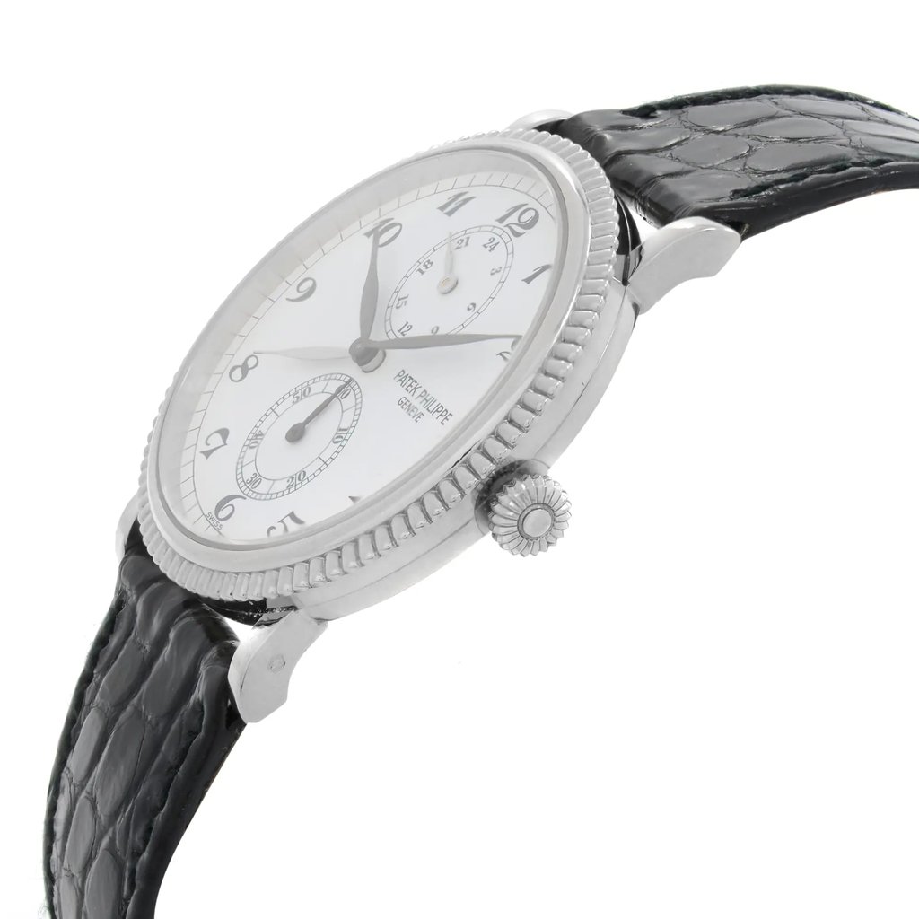 An image of a Wristwatch by Patek Philippe. This Pre Owned item is designed for Men, featuring a Dress/Formal,Luxury style. It has a Mechanical (Manual) movement and an Analog display with a White dial color. The indices include 12-Hour Dial,Arabic Numerals,Multi Dial. The band is made of Leather and the case is made of White Gold. The watch has a Round shape with a case size of 34 mm and a case thickness of 8 mm.