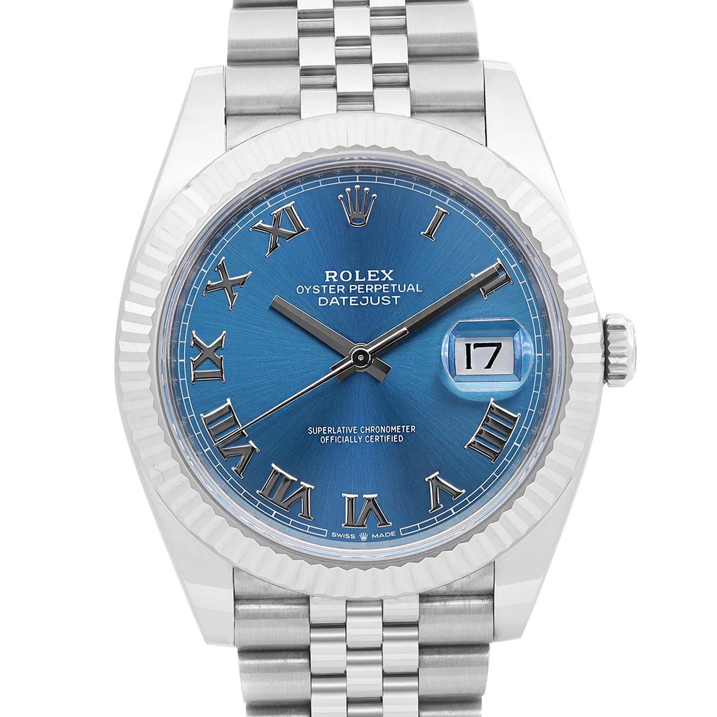 An image of a new Rolex Oyster Perpetual Datejust men's wristwatch, shown in a front close-up shot highlighting the watch face at a direct angle. The watch features a round shape with a blue dial, Roman numeral indices, and a date indicator at the 3 o'clock position. The bezel is white gold, and the stainless steel band is visible in the foreground, suggesting the watch is being viewed from a close distance. The overall condition is excellent, and the style exudes luxury.