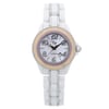 An image of a new Lucien Piccard women's wristwatch with defects, presented in a full frontal view. The watch features a round case and band made from a combination of ceramic and stainless steel, with a white dial that has a mother of pearl pattern. Arabic numerals mark the 12-hour dial, and the bezel is beige with pink accent stones. The watch is positioned straight on and photographed from a close distance, allowing for a clear view of the design details, although water damage on the bezel under the insert may not be immediately visible without closer inspection from certain angles.