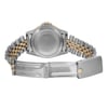 An image of a pre-owned wristwatch, viewed from the back. The watch features a two-tone metal bracelet with interlocking silver and gold links. The clasp is open and positioned at the bottom of the image, revealing its inner mechanism. The watch case is centrally positioned, showcasing its smooth, round back. The angle is straight-on, capturing the details of the bracelet and clasp at a close distance.