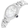 An image of an unworn RAYMOND WEIL women's wristwatch in a side profile view, positioned at a slight angle with the crown facing the viewer. The watch features a white mother of pearl dial and a round stainless steel case, complemented by a stainless steel band. The watch has a dress/formal style with a close-up perspective, showcasing the crown's detail and the watch's design clearly.