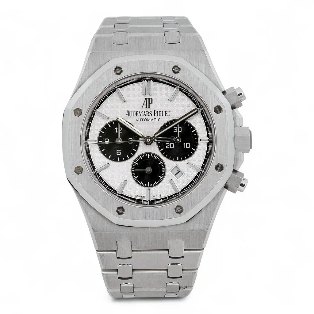 An image of a pre-owned Audemars Piguet  Royal Oak Silver Dial Steel Automatic Watch mens wristwatch. The watch is positioned upright and facing forward, showcasing its detailed face and luminous hands. The angle is straight-on, providing a clear view of the watch's features, including its chronograph dials and textured bezel. The distance captures the entire watch, highlighting its metallic band and sleek design. No original box and papers. Recently serviced. The movement is calibrated and keeps time well, It shows light signs of wear.