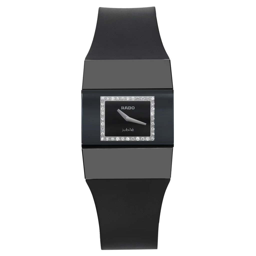 An image of a new Rado women's wristwatch with defects, presented in a full frontal view. The watch features a casual style with a black rectangular ceramic case and a rubber band. The dial is black with a diamond pattern and is surrounded by a black bezel. Notably, the dial has no hour marks but does have a 12-hour display. Although the watch is new and has never been worn, it has micro scratches on the case due to store handling. The image is taken from a close, direct angle, showcasing the entire front view of the watch.