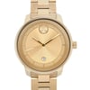 An image of a pre-owned wristwatch taken from a front close-up angle, showcasing the watch's face. The watch features a gold-toned design with sleek hour and minute hands, a small circular date window at the 6 o'clock position, and a minimalist, elegant dial. The watch is positioned centrally in the frame, highlighting its polished, sophisticated appearance.
