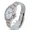 An image of a pre-owned men's Rolex wristwatch, viewed from a slightly elevated angle to the right. The watch features a stainless steel band and a white dial with black numeral hour markers. It includes a date indicator and luminous hands. The watch is positioned on a transparent stand, with the bracelet partially open, showcasing its side profile.