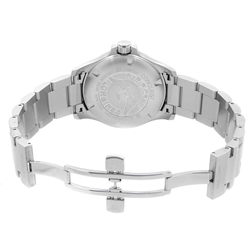 An image of a wristwatch taken from the back view, showcasing the open clasp. The watch features a stainless steel band, prominently displayed in a slightly elevated angle. The case back is visible, highlighting the engraved details. The image is captured from a close distance, emphasizing the intricate design and craftsmanship of the display model.