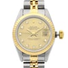 An image of a pre-owned women's Rolex wristwatch, positioned upright and captured from a front-facing angle. The watch features a two-tone metal bracelet with gold and stainless links. The dial is gold with diamond hour markers and a date indicator at the 3 o'clock position. The bezel is gold, complementing the overall elegant design. The image is taken at a close distance, highlighting the watch's intricate details.