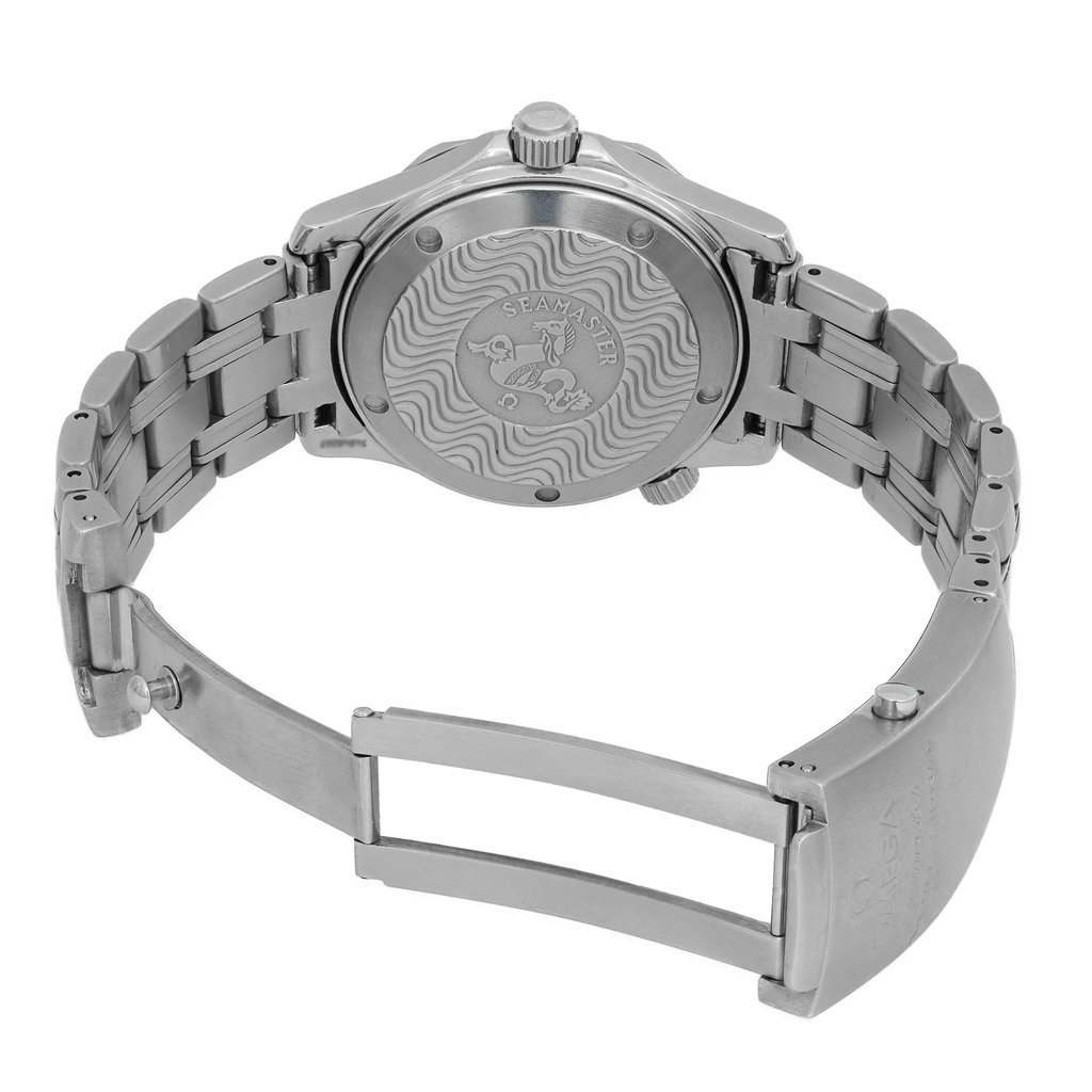 An image of a pre-owned wristwatch viewed from the back, showcasing an open clasp. The watch is positioned to highlight the detailed engravings on the back case, with a visible wave pattern and emblem. The angle captures the metal bracelet links and the open clasp mechanism. The photograph is taken from a close distance, focusing on the intricate design and condition of the watch.