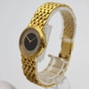 An image of a pre-owned Audemars Piguet women's wristwatch positioned at a slight angle, showcasing the right side and front. The watch features a yellow gold bracelet with a onyx face encircled by a diamond-studded bezel. The watch is displayed on a transparent stand, with the background softly blurred, highlighting its luxurious design.