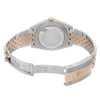 An image of a pre-owned Rolex men's wristwatch with a screwback caseback in good condition, seen from the back view. The stainless steel case and fold-over clasp are visible, with a rose gold band accent. The watch is shown at a close distance, slightly angled to reveal the clasp and band. Light signs of wear or scratches may be present.