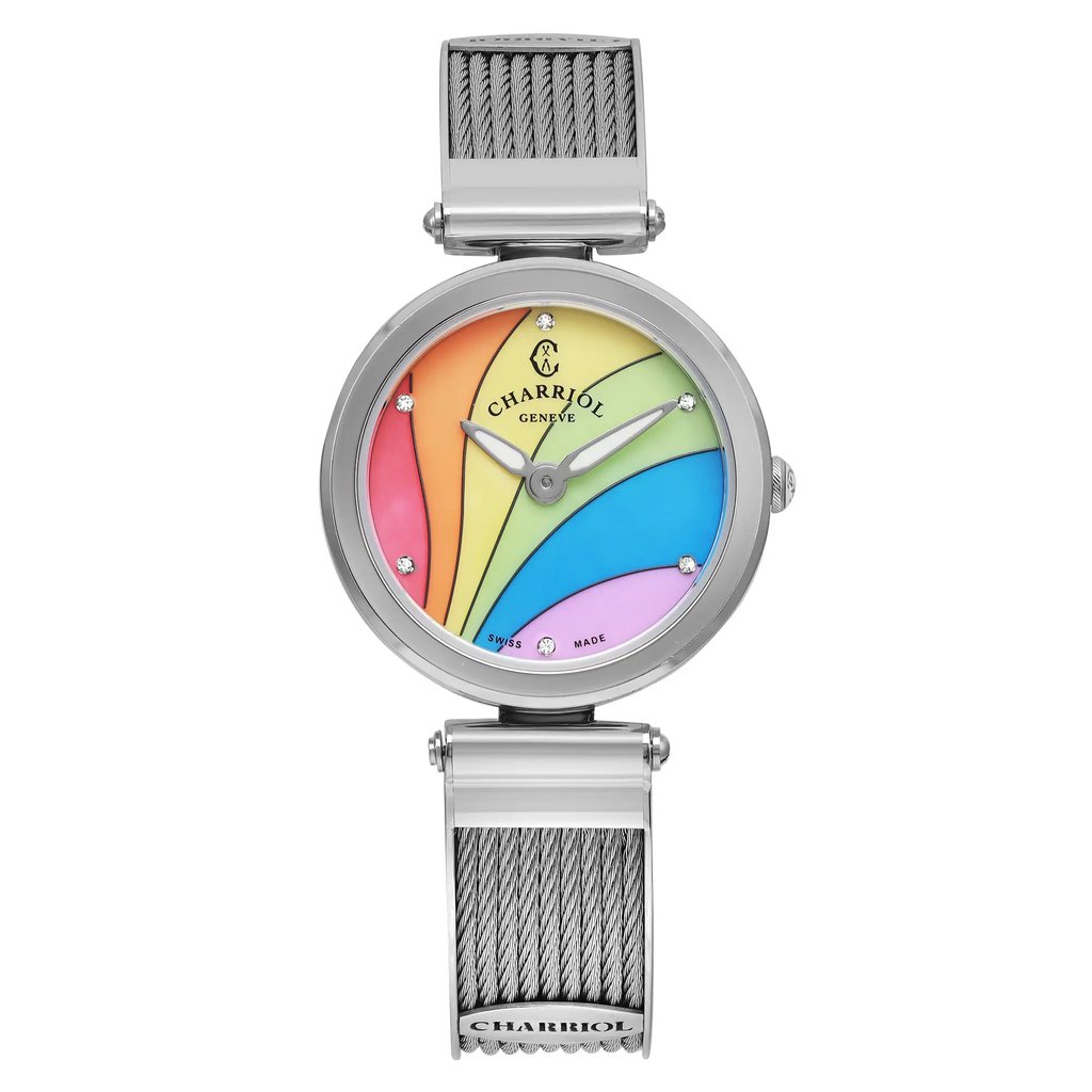 An image of a pre-owned wristwatch shown from a front full frontal view. The watch features a colorful, multi-hued dial with a spectrum of colors including red, yellow, green, blue, and pink. It has a sleek silver case and a silver mesh strap. The watch face is adorned with small crystal markers and silver hands. The photo is taken at a close distance, highlighting the intricate details of the design.