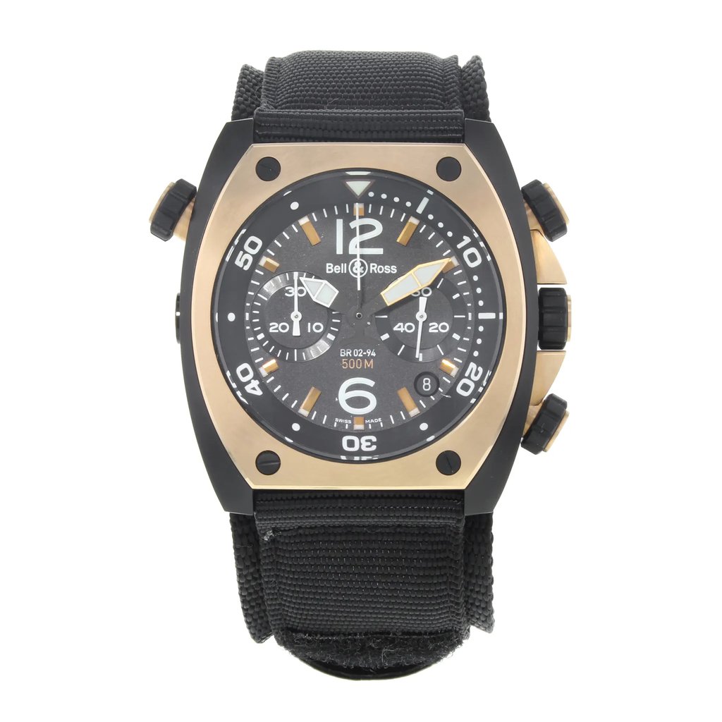 An image of a Bell & Ross men's luxury diver wristwatch, model displayed in a full frontal view. The watch features a distinctive tonneau shape with a black dial, rose gold bezel, and stainless steel case. It is fitted with a black fabric/canvas band. The dial includes large numeral indices, a seconds hand, and stick markers for easy reading. The watch is positioned centrally and shot at a close, direct angle to clearly showcase its design and details.