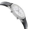 An image of a pre-owned wristwatch viewed from the side profile, opposite the crown. The watch features a textured black leather strap and a silver-toned case with a ridged bezel. The white dial displays black numerals and hands, with two subdials visible. The angle is slightly tilted upwards, providing a clear view of the watch's face and detailing. The shot is taken from a close distance, emphasizing the craftsmanship and design elements.
