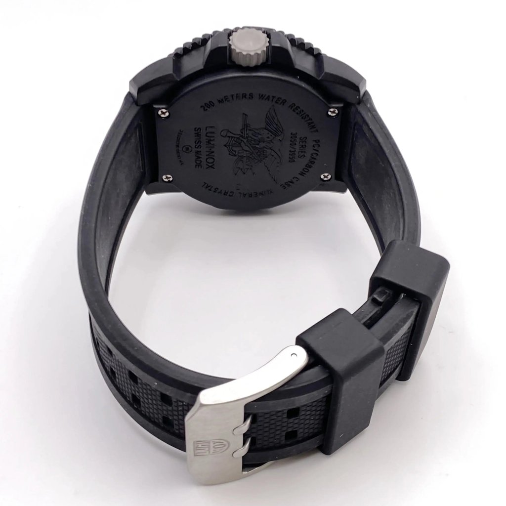 An image of a Wristwatch by Luminox. This Pre Owned item is designed for Men, featuring a Casual,Classic,Diver,Military style. It has a Quartz movement and an Analog display with a Black dial color. The indices include 12-Hour Dial,Arabic Numerals. The band is made of Rubber and the case is made of Carbon. The watch has a Round shape with a case size of 44 mm and a case thickness of 14 mm.