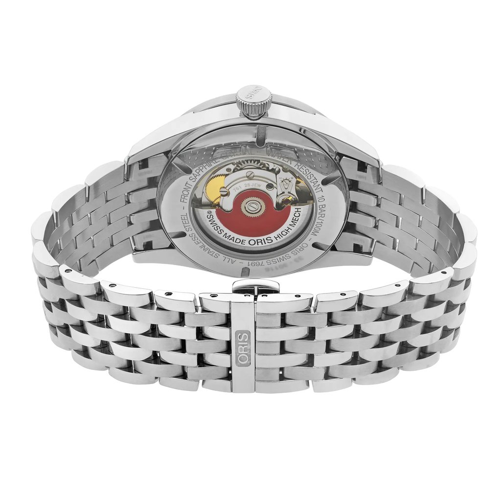 An image of a wristwatch showcasing the back view of the display model. The focus is on the closed clasp and the see-through case back, revealing the intricate mechanism inside. The angle is slightly elevated, providing a clear view of the stainless steel bracelet and the watch's detailed movement. The photograph is taken from a close distance, highlighting the craftsmanship and design elements.