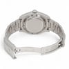 An image of a pre-owned men's Rolex wristwatch viewed from the back at a slight angle, showcasing the closed clasp and stainless steel bracelet. The watch is positioned on a neutral background, photographed at a medium distance, highlighting the engraved details on the case back and clasp. The luminous hands feature is not visible in this view.