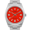 An image of a pre-owned men's Rolex wristwatch, positioned vertically and viewed from the front at a close angle. The watch features a vibrant red dial with luminous hands and hour markers, enclosed in a stainless steel case with a matching bracelet. The brand's name and logo are visible on the dial.