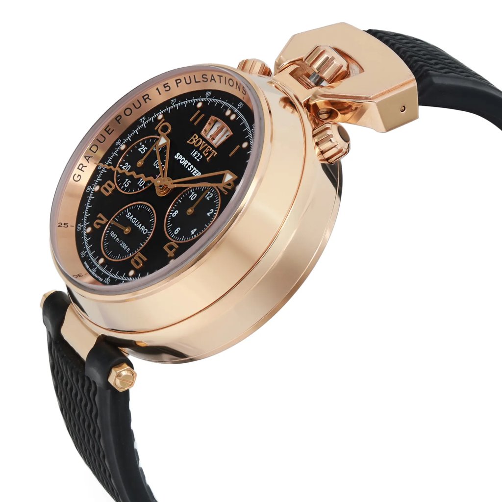 An image of a pre-owned wristwatch viewed from a side profile angle, showcasing the crown. The watch features a round, gold-toned case with a black dial displaying multiple sub-dials. The timepiece is attached to a textured black strap. The focus is on the crown and detailing on the case, captured at a close distance.