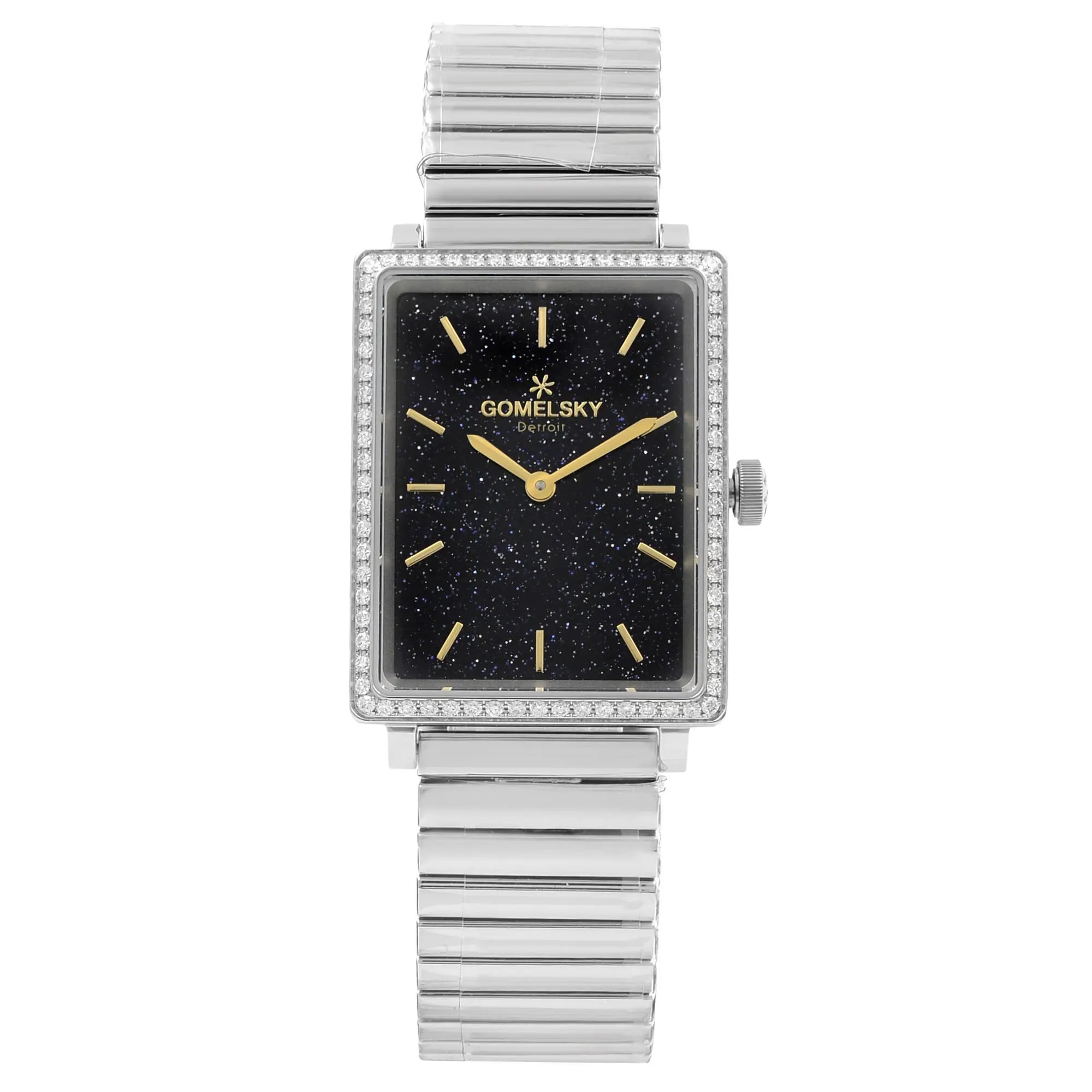 An image of a wristwatch in an unworn condition, displayed from a front full frontal view. The watch features a rectangular face with a black starry dial and gold hour markers and hands. The face is encased in a bezel adorned with small gemstones. The watch has a silver metallic strap with a polished, ribbed texture. The brand name is visible on the dial.