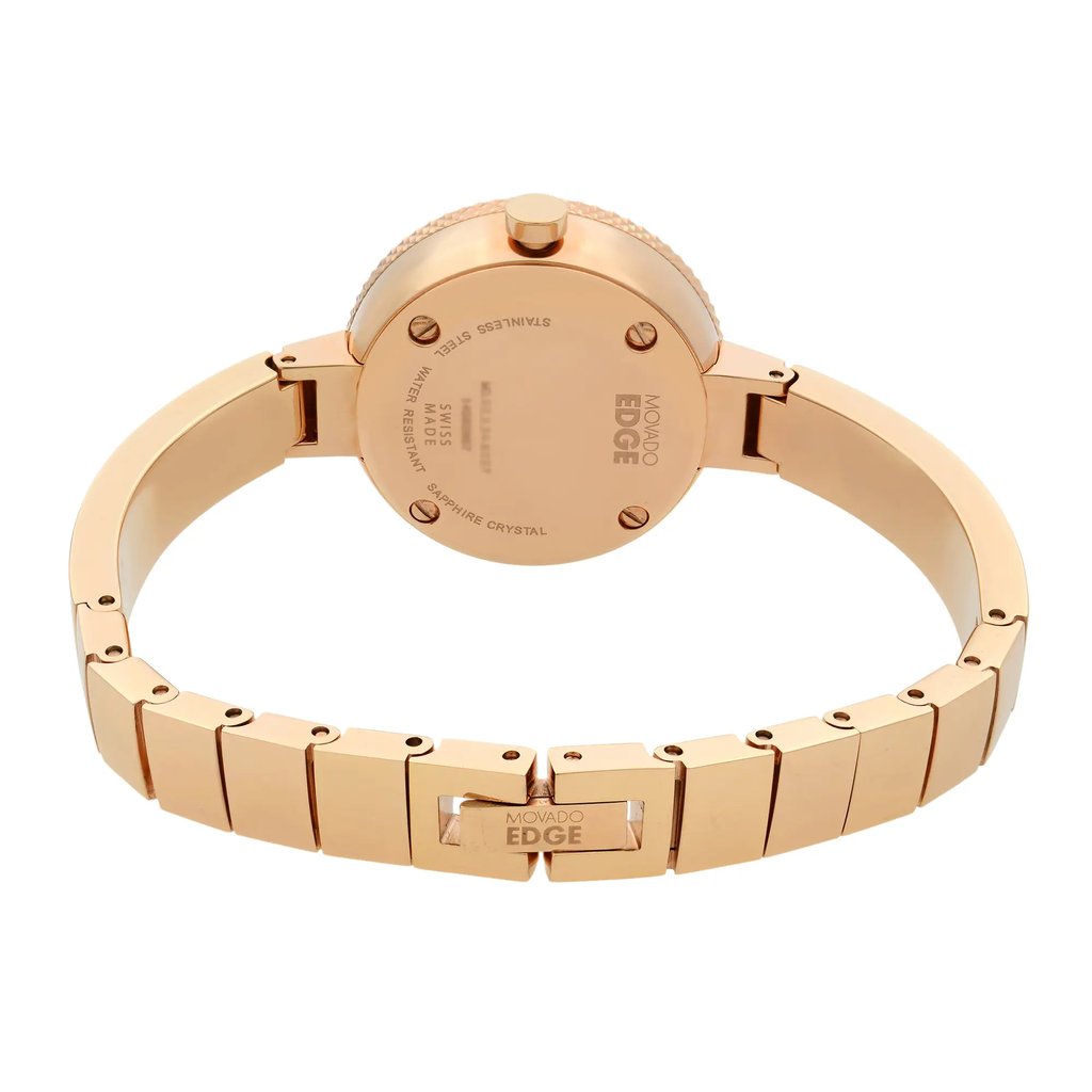 An image of a pre-owned wristwatch taken from a back view, showcasing the closed clasp. The watch is positioned centrally, with a slight angle that highlights the stainless steel back and clasp details. The close-up perspective emphasizes the branding and inscriptions on the back, as well as the elegant, polished finish of the band.