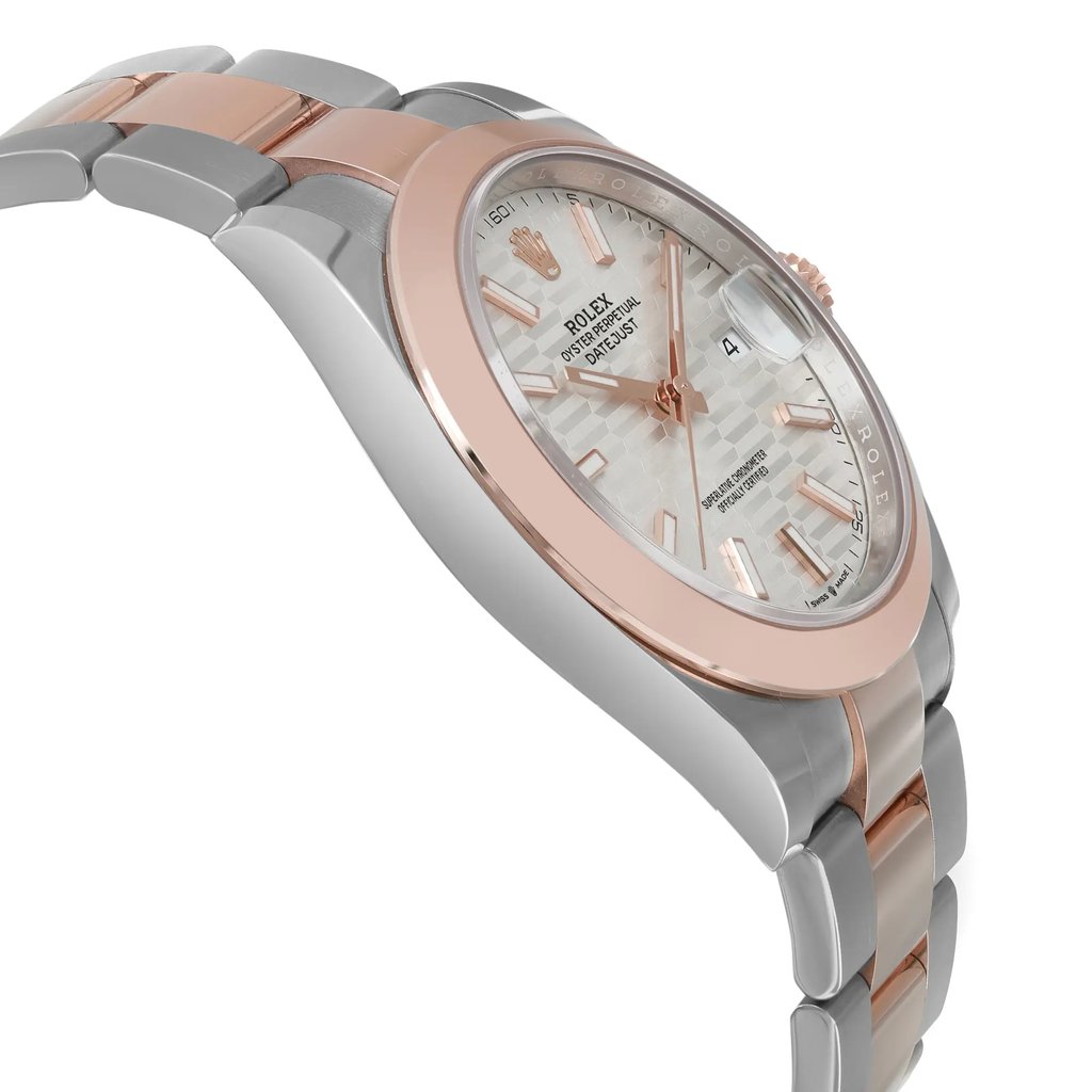 An image of an unworn men's Rolex wristwatch in a side profile view, opposite of the crown. The watch features a round shape with a sunburst silver dial, luminous hands, and a date indicator at the 3 o'clock position. Its bezel is rose gold, complementing the rose gold and stainless steel band. The case material is stainless steel, and the overall style is dress/formal and luxury. The watch is displayed at a close distance, showing a clear view of the side angle.
