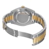 An image of an unworn Rolex wristwatch for men, viewed from the back with the clasp open. The watch features a round stainless steel case with a screwback, and a stainless steel and yellow gold band. The fold-over clasp is visible and open, positioned in the foreground at a slight angle. The distance is close-up, providing a clear view of the watch's construction and materials. Visible features include the brand engraving on the inner side of the band.