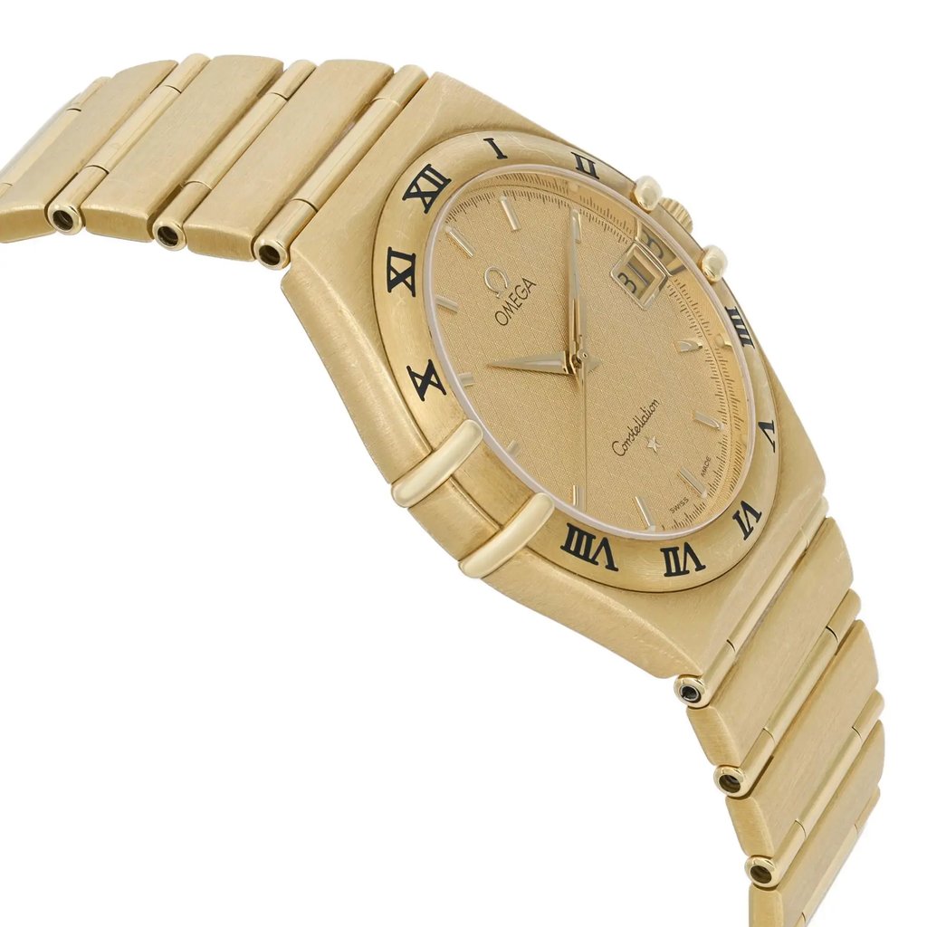 An image of a pre-owned wristwatch featuring a side profile view, opposite the crown. The watch has a gold-toned case and a matching bracelet. Roman numerals encircle the bezel, and the dial displays a date window. The photo is taken at a slight angle from the side, highlighting the watch's thickness and design details.