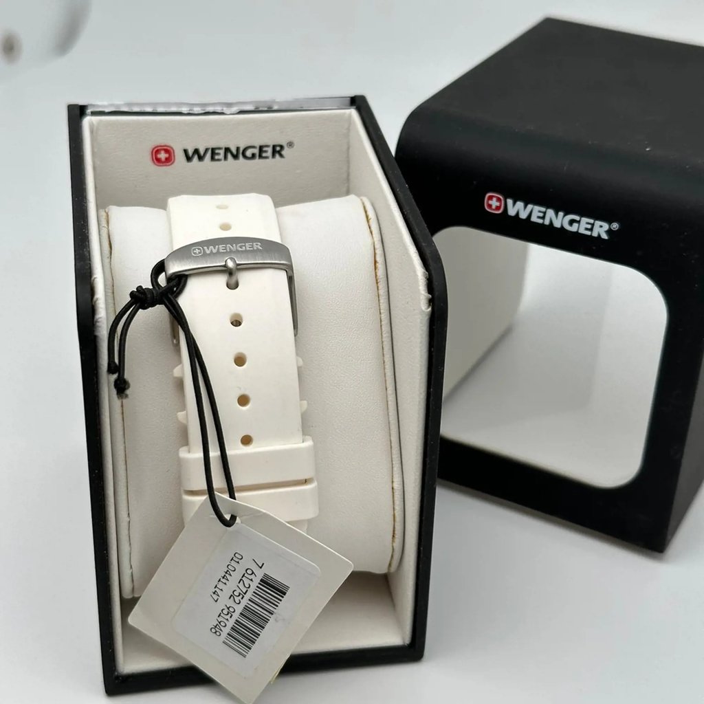 An image of a Wristwatch by Wenger. This Display Model item is designed for Men, featuring a Casual style. It has a Quartz movement and an Analog display with a White dial color. The indices include 12-Hour Dial,Arabic Numerals. The band is made of Rubber and the case is made of Stainless Steel. The watch has a Round shape with a case size of 41 mm and a case thickness of 10 mm.