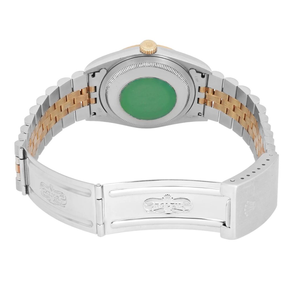 An image of a pre-owned men's Rolex wristwatch, viewed from the back at a slightly elevated angle. The focus is on the closed clasp and the two-tone metal bracelet featuring steel and gold links. The green sticker on the watch case back and the gold winding crown are visible. The image captures the watch from a close distance, highlighting its details and craftsmanship.