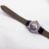 Back View Of Exhibition Back Case And Closed Leather Band Of Tissot T055.430.16.057.00 Watch Pre Owned Condition