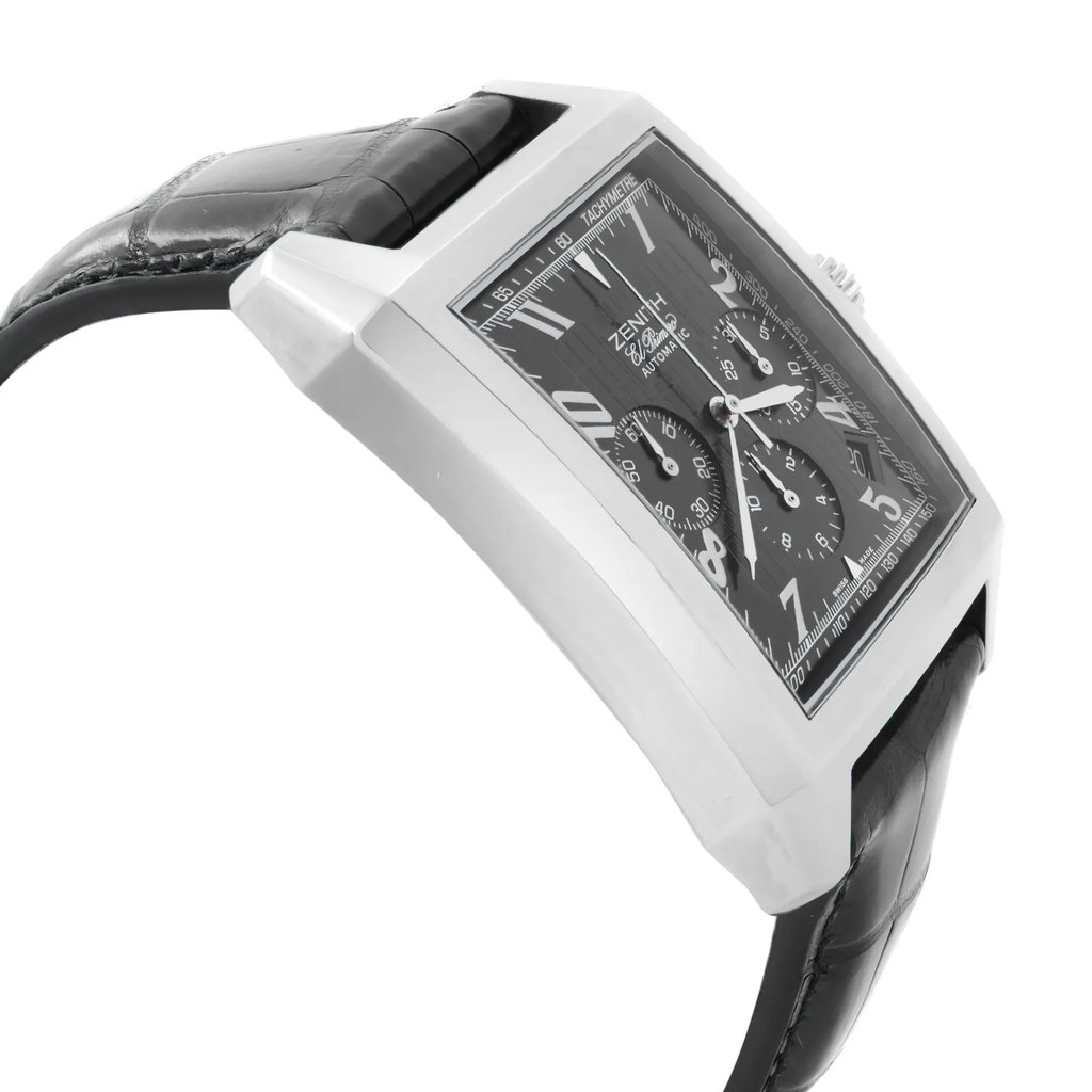 An image of a pre-owned wristwatch taken from a side profile view opposite the crown. The watch features a rectangular case with a visible black strap. The dial displays multiple sub-dials and prominent hour markers. The photograph is taken at a slight angle, offering a clear view of the watch's thickness and strap attachment, from a close distance.