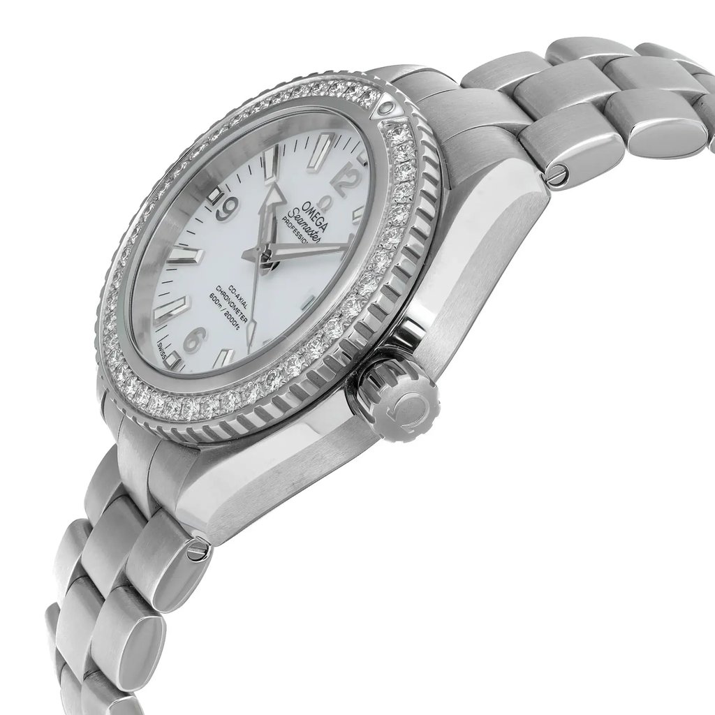 An image of a pre-owned women's luxury OMEGA wristwatch shown from a side profile view. The focus is on the stainless steel crown, positioned prominently. The watch features a round stainless steel case with a gray bezel and a white dial. Luminous hands and a date indicator are visible. The stainless steel band complements the elegant design.