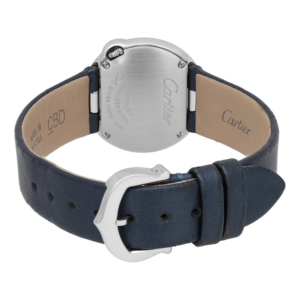 An image of a pre-owned Cartier women's wristwatch, captured from the back at a slight angle. The watch features a stainless steel case with inscriptions, and a dark blue leather strap. The strap's buckle is prominently displayed, with the watch positioned centrally and viewed from a close distance.