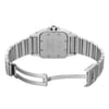 An image of a pre-owned Cartier women's wristwatch, presented in a back view with an open double-locking fold-over clasp. The watch has a square stainless steel case with a screwback, visible from a direct overhead angle. The band, also made of stainless steel, shows minor signs of wear. The Cartier logo is subtly engraved on the clasp, and the watch is positioned centrally in the frame with a medium distance from the camera, allowing for clear visibility of the watch's details.