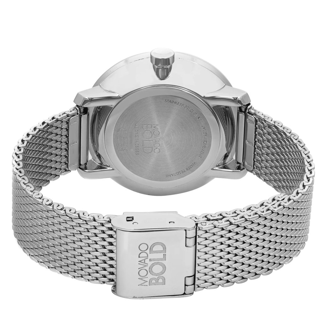 An image of a pre-owned wristwatch showing the back view and close-up of the clasp. The watch features a stainless steel mesh band with a visible "Movado Bold" logo on the clasp. The angle captures the watch from a slightly elevated rear perspective, emphasizing the polished case back and the intricate detailing of the metal strap.
