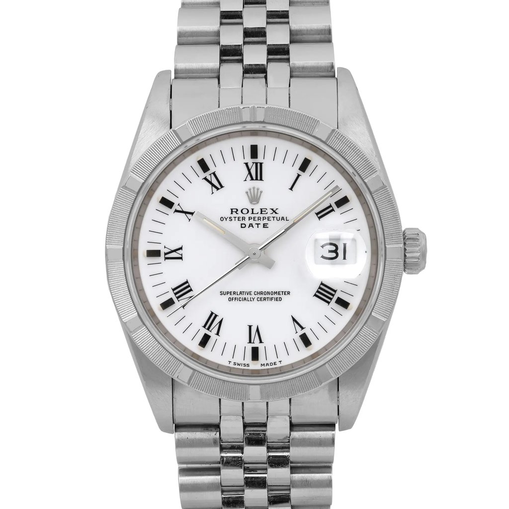 An image of a pre-owned Rolex wristwatch, positioned upright and viewed from a slightly elevated angle. The watch features a stainless steel band and a white dial with black Roman numerals. Luminous hands are visible, and a date indicator is prominently displayed at the 3 o'clock position. The photograph is taken at a close distance, capturing the intricate details of the watch face and bezel.