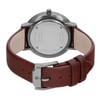 An image of a pre-owned wristwatch viewed from the back, showing a close-up of the closed clasp. The watch has a stainless steel back with inscriptions and a brown leather strap. The shot is taken from a slightly elevated angle, focusing on the details of the clasp and strap at a close distance.