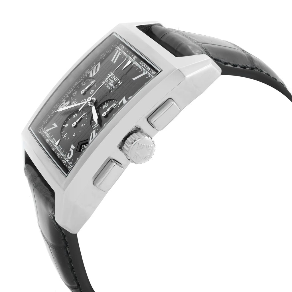 An image of a pre-owned wristwatch taken from a side profile view, displaying the crown and pushers prominently. The watch features a rectangular case with a black strap. The perspective highlights the crown's details and the watch's sleek design, suggesting a slightly elevated angle and moderate distance to capture the full side profile.