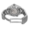 An image of a pre-owned women's OMEGA wristwatch showcasing the back view with an open clasp. The watch features a round stainless steel case and exhibition caseback, allowing a view of the internal mechanism. The stainless steel band is partially visible, ending in a fold-over clasp with a double push button. The angle provides a clear view of the clasp and back, emphasizing the detailed craftsmanship and branding engraved on the caseback.