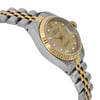 An image of a pre-owned wristwatch viewed from the side profile opposite the crown. The watch features a gold and silver-tone bracelet and a gold bezel. The dial is gold with diamond hour markers and a date display. The focus is on the watch face and the side of the case, captured at a medium distance.