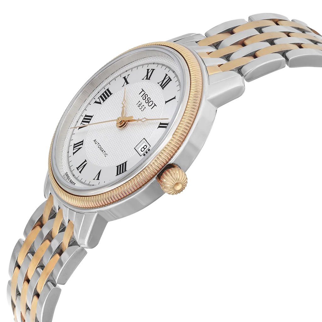 An image of a Wristwatch by Tissot. This Pre Owned item is designed for Men, featuring a Dress/Formal style. It has a Mechanical (Automatic) movement and an Analog display with a Silver dial color. The indices include 12-Hour Dial,Roman Numerals. The band is made of Stainless Steel and the case is made of Stainless Steel. The watch has a Round shape with a case size of 40 mm and a case thickness of 9 mm.