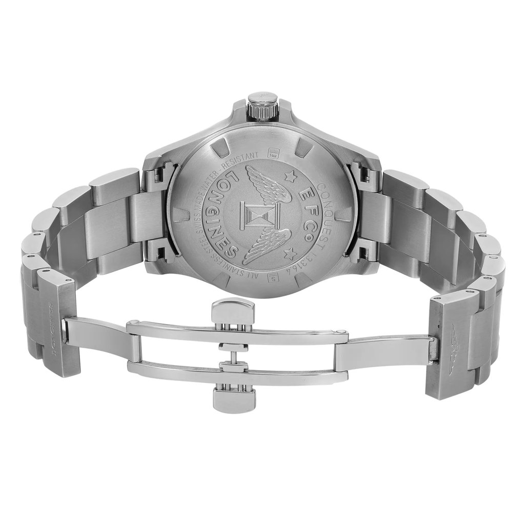 An image of a pre-owned Longines women's wristwatch in like-new condition, showing the back view of the watch with an open fold-over clasp. The watch is positioned centrally, with the camera angle directly above the watch, providing a clear view of the screwback caseback which features an embossed Longines logo and text. The stainless steel band extends from both the top and bottom of the watch case, with the clasp open and lying flat, indicating the mechanism for securing the watch on a wrist. The photo is taken from a medium distance, allowing the entire back side of the watch and the open clasp to be visible within the frame.