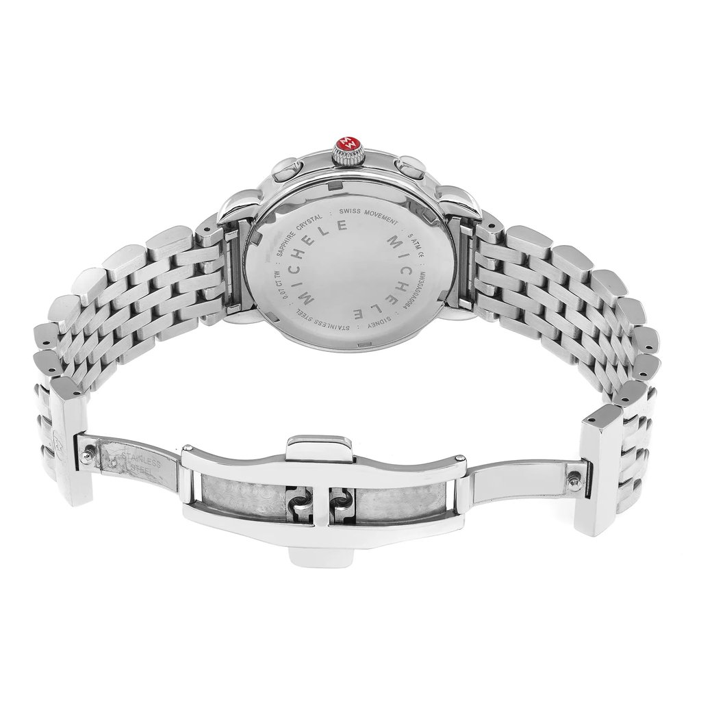 An image of a pre-owned wristwatch showing the back view with an open clasp. The watch is positioned horizontally, capturing the stainless steel bracelet and the engraved details on the back case. The angle is slightly elevated, providing a clear view of the open clasp mechanism. The distance is close enough to display intricate details, including the brand name.