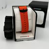 An image of a Wristwatch by Wenger. This Display Model item is designed for Men, featuring a Casual style. It has a Quartz movement and an Analog display with a Black dial color. The indices include 12-Hour Dial,Arabic Numerals,Stick Indexes. The band is made of Nylon and the case is made of Stainless Steel. The watch has a Round shape with a case size of 41 mm and a case thickness of 10 mm.