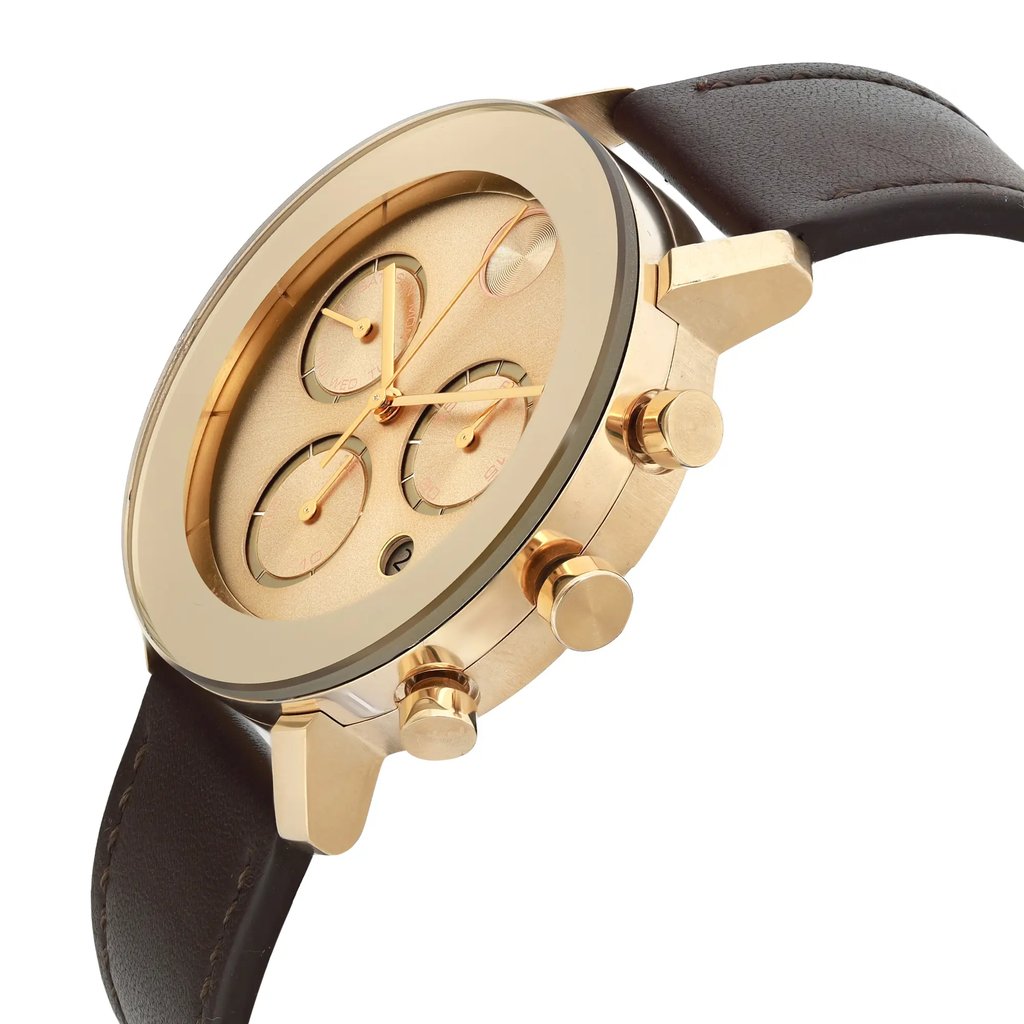 An image of a pre-owned wristwatch viewed from a side profile angle, highlighting the gold-toned case and prominently displaying the crown. The watch face features multiple subdials and gold hands, complemented by a dark leather strap. The photograph is taken from a close distance, emphasizing the watch's design and details.